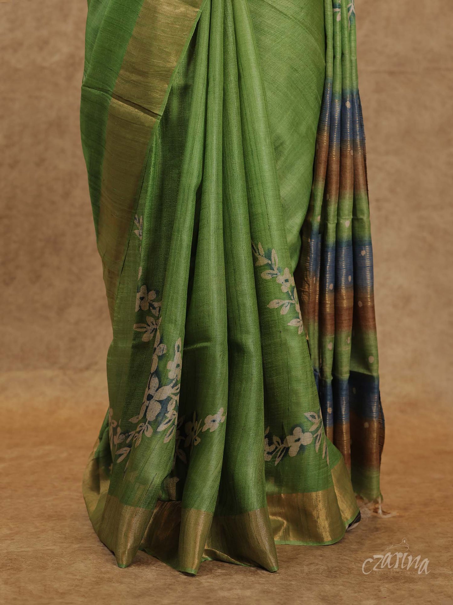 GREEN WITH GOLDEN BORDER AND FLORAL PRINTS TUSSAR SILK SAREE