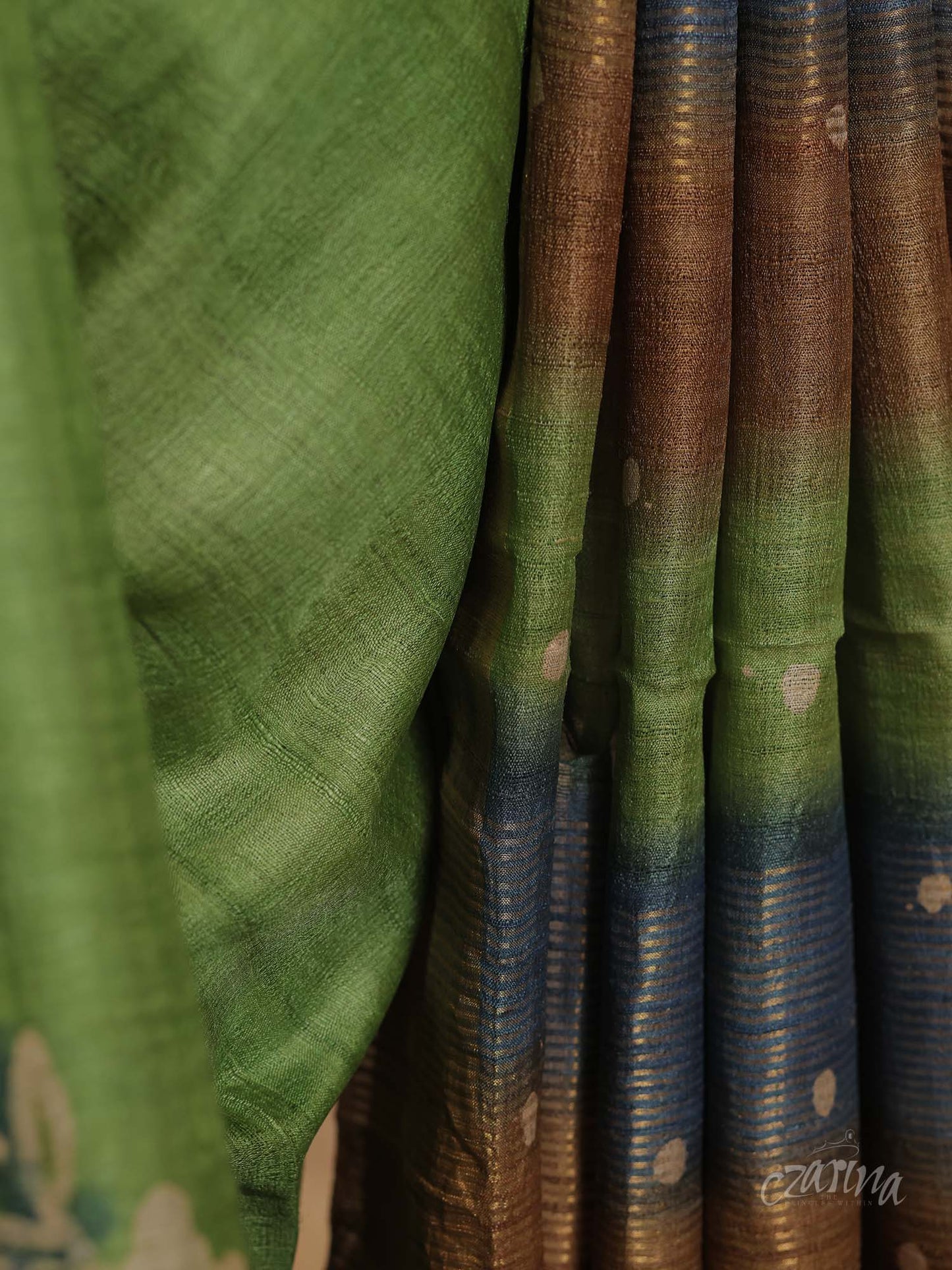 GREEN WITH GOLDEN BORDER AND FLORAL PRINTS TUSSAR SILK SAREE