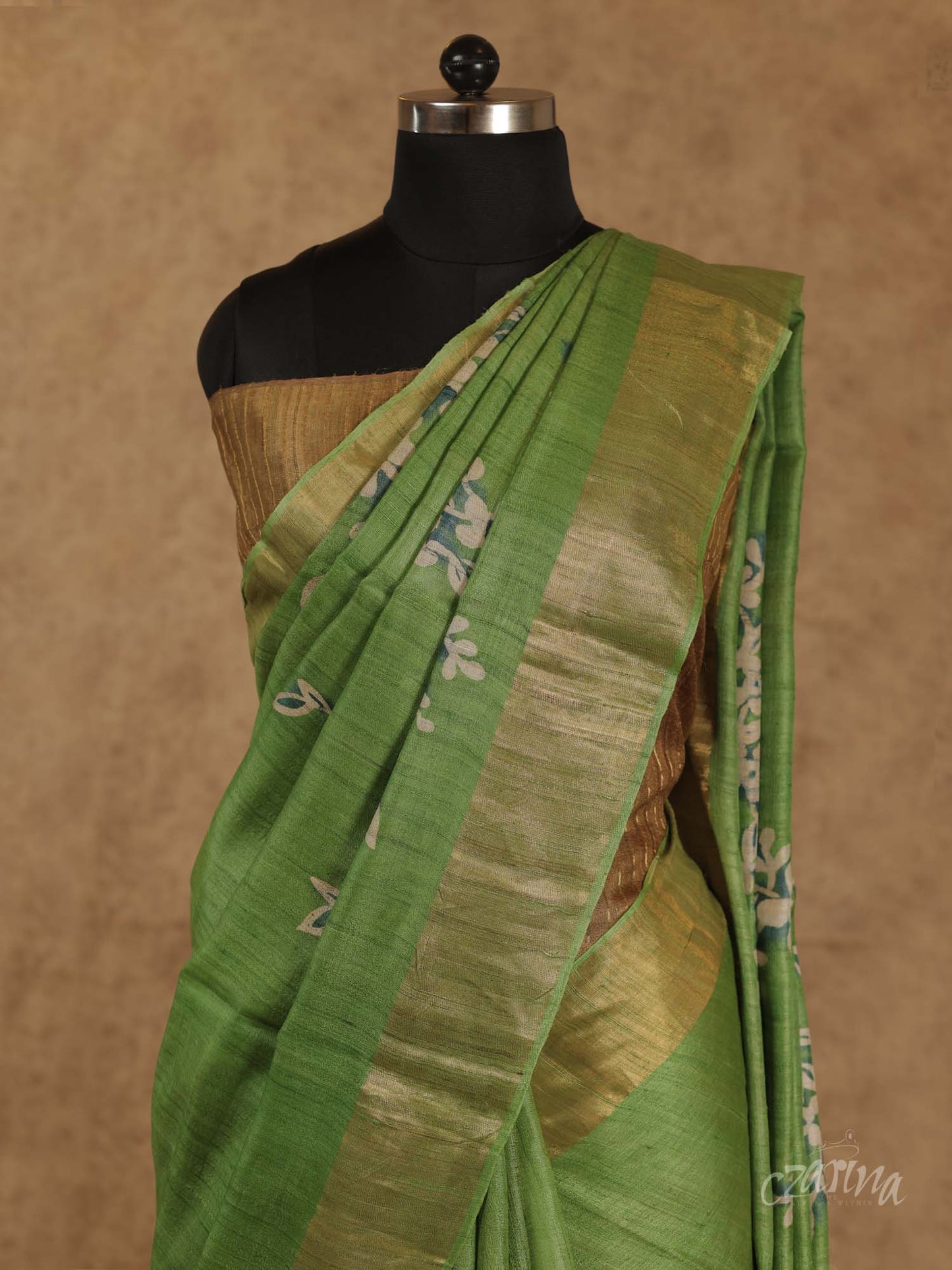 GREEN WITH GOLDEN BORDER AND FLORAL PRINTS TUSSAR SILK SAREE