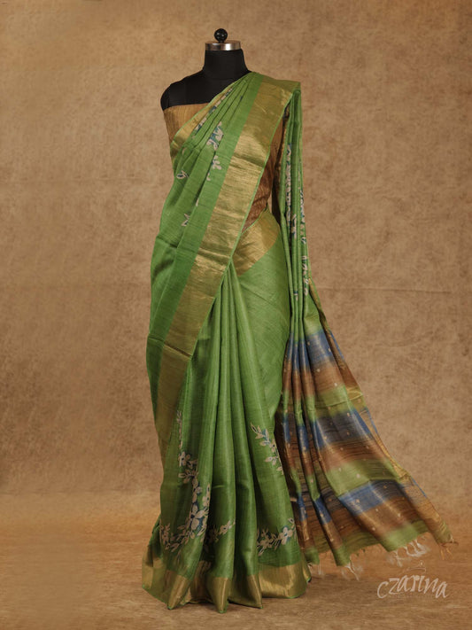 GREEN WITH GOLDEN BORDER AND FLORAL PRINTS TUSSAR SILK SAREE