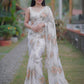 Off white pure organza saree with Dusty Peach floral motifs and delicate beadwork