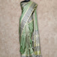 LIGHT OLIVE GREEN LIGHTWEIGHT WITH BEIGE BORDER AND GREY AND GOLD THREADWORK KANCHIPURAM SAREE