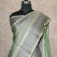 LIGHT OLIVE GREEN LIGHTWEIGHT WITH BEIGE BORDER AND GREY AND GOLD THREADWORK KANCHIPURAM SAREE