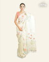 CREAMY YELLOW LINEN SAREE WITH ALL OVER SEQUINS WEAVING AND MULTICOLORED FLORAL PAINTED DESIGNS