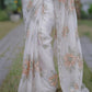 Off white pure organza saree with Dusty Peach floral motifs and delicate beadwork